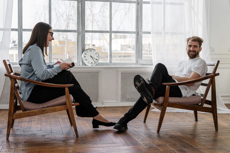 Two people sit in chairs across from one another as they share a laugh. This could represent progress being made with individual therapy in Sacramento, CA. Contact us to learn more about affair recovery in Sacramento, CA. Contact an individual therapist for support with infidelity recovery in Pasadena, CA and other services. 95814 | 95688 | 95765