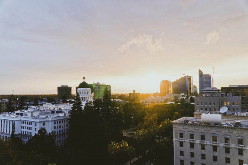 An image of a city skyline as the sun rises for California Integrative Therapy. Learn more about therapy in Sacramento, CA and the other services we offer. A trauma therapist in Sacramento, CA can address the issues that matter to you! 95835 | 95765 | 95747