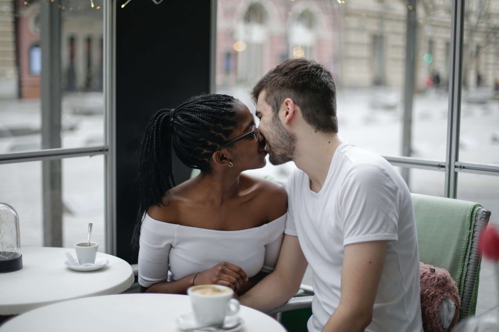 A couple shares a kiss representing a couple who has learned to communicate more effectively in Couples Counseling in Pasadena, CA.