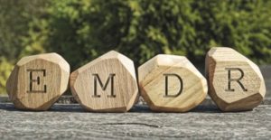 Blocks of wood spell out the name EMDR. Pasadena Trauma Therapy using EMDR at California Integrative Therapy. 91101