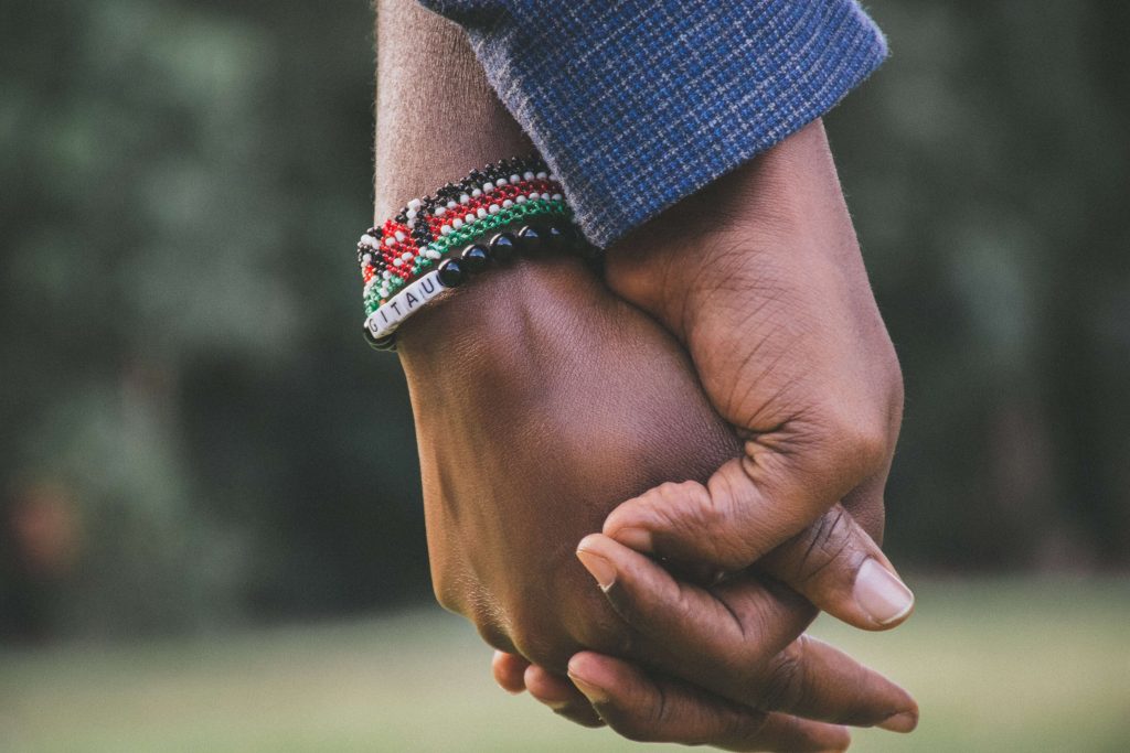 A couple holds hands after rebuilding trust through Couples Therapy in Pasadena, CA.